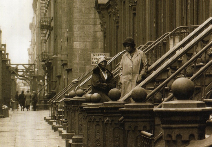 two women on a stoop. postcard caption reads: NYC Tenement Series #110. West 53rd St., Manhattan - 1927